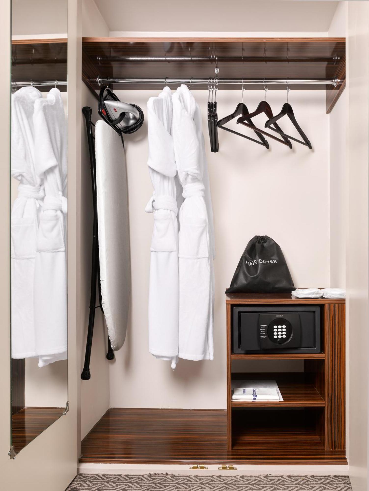 Strand Palace London Exterior photo A wardrobe in a hotel room
